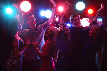 Young people having fun dancing at party.