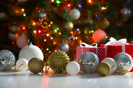 Christmas presents and balls against the backdrop of a festive Christmas tree