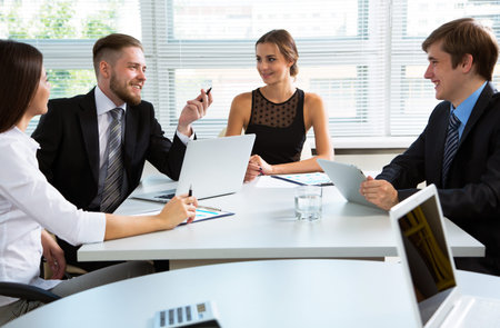 Group of happy business people in a meeting at office