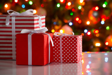 Christmas presents and balls against the backdrop of a festive Christmas tree