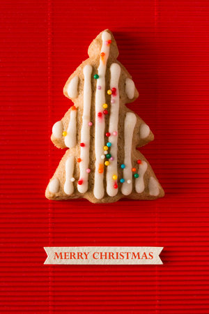 A postcard with a picture of a cookie Christmas tree for greeting your friends