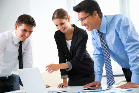 Business people working with laptop in an officeの写真素材