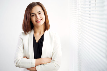 Business woman portrait. Crossed arms