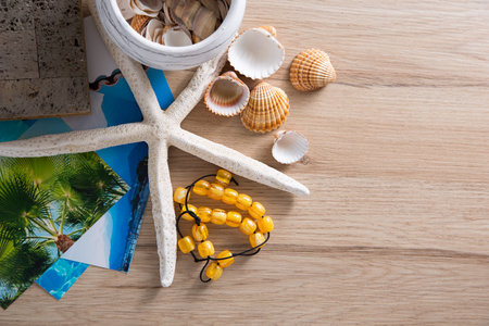 Composition of sea shells, stars and album reminiscent of the summer holidays.の写真素材