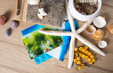 Composition of sea shells, stars and album reminiscent of the summer holidays.の写真素材