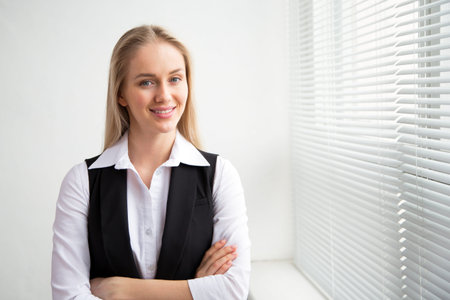 Portrait of a business woman against a window.