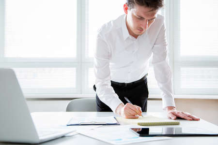 Businessman working with computer in an office. Close-upの写真素材