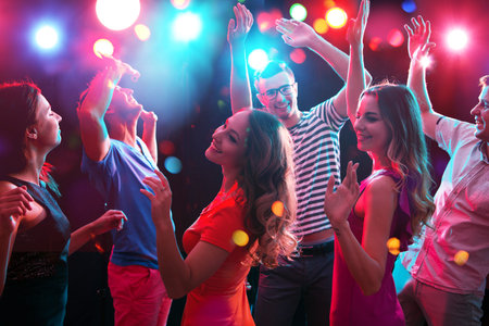 Young people having fun dancing at party.