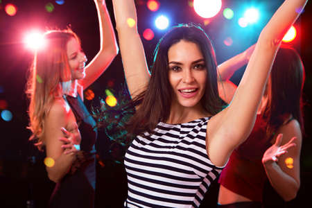 Happy girls fun dansing at a partyの写真素材