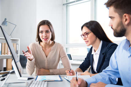 Businessman with colleagues at a presentation in the officeの写真素材