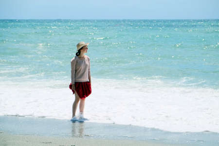 Pretty girl tourist on the beachの写真素材