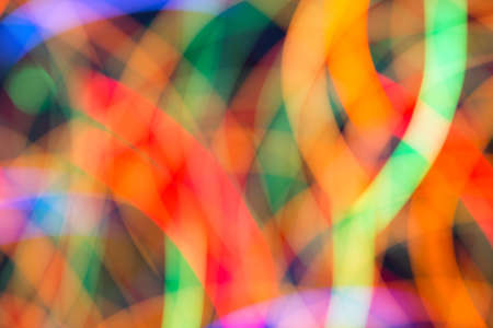 Abstract picture of bright colored dynamic lights on a dark backgroundの写真素材