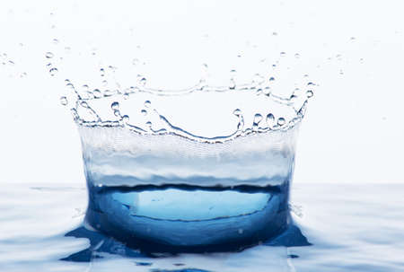 Beautiful splash of blue freshnes water isolated on whiteの写真素材