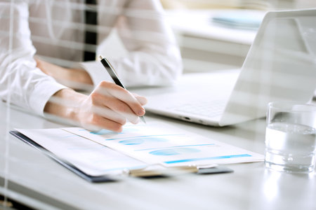 Businessman working in an office. Close-up