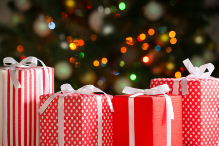 Christmas gifts on colored festive lights.
