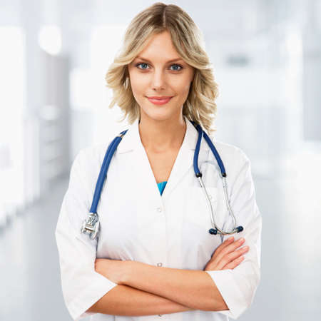 Young female doctor on modern clinic background.の写真素材