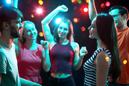 Group of happy young people having fun dancing at party.の写真素材