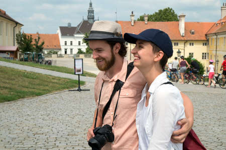 Young couple walk in the old city on a tourist trip.の写真素材