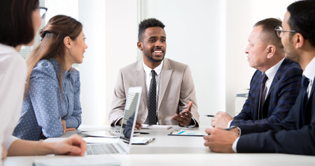 Multy-ethnic group of business people working at the office desk