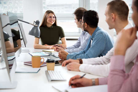 Multy-ethnic group of business people working at the office deskの写真素材