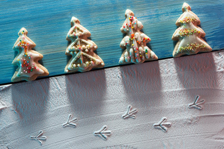 ? hristmas card with? hristmas tree cookies and image of bird footprints on the snow and place for...
