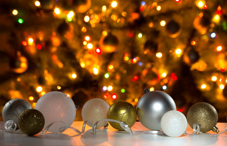 Christmas balls against the backdrop of a festive Christmas tree.の写真素材