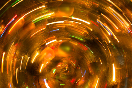 Abstract background of bright colored dynamic lightsの写真素材