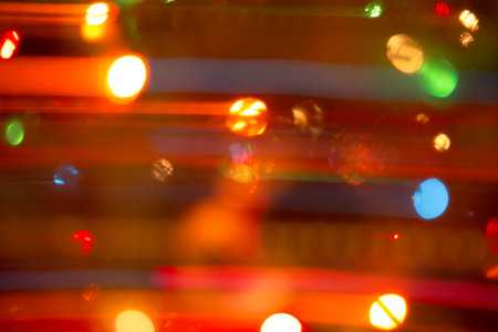 Abstract background of bright colored dynamic lightsの写真素材