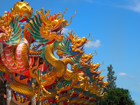 Chinese dragon statue Climb the pole on the sky background.の写真素材