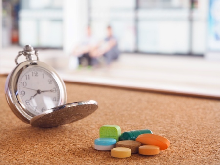 The clock to tell time to take medicineの写真素材