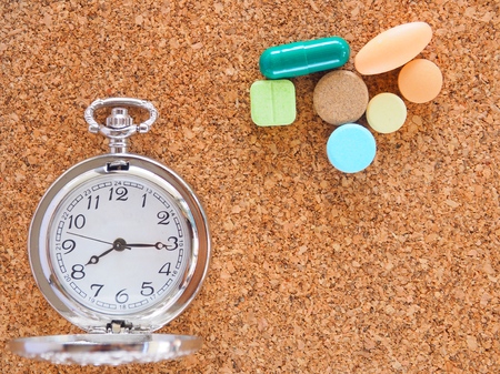 The clock to tell time to take medicineの写真素材
