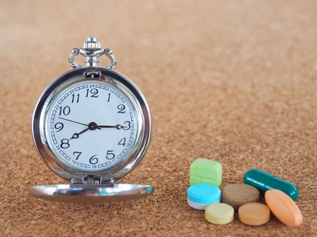 The clock to tell time to take medicineの写真素材