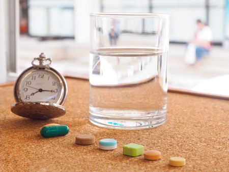 The clock to tell time to take medicineの写真素材