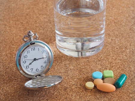 The clock to tell time to take medicineの写真素材