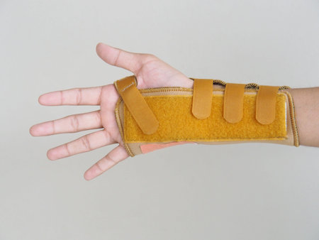 Wrist-Brace-with-Splint Put on the right arm of the boy. After he broke his arm with an accident....
