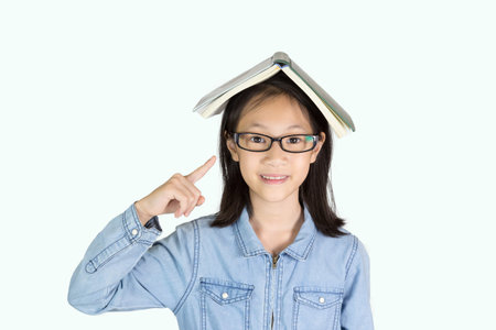 Asian girl with hand holding book isolated on white background