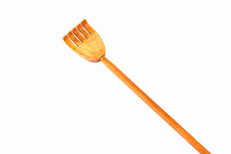 Wooden back scratcher isolated on white backgroundの写真素材