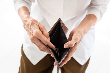 Empty wallet in the hands of Senior asian people  in wrinkled hands,Elderly woman hands open an...