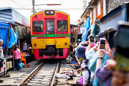 Samut Songkhram,Thailand-May 13,2019:Tourists at Talat Rom Hup,people visit Mae Klong Railway market...