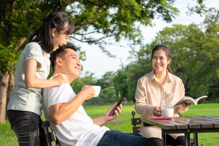 Happy asian family,little child girl or daughter enjoy,father talk,fun together,parents drink coffee...
