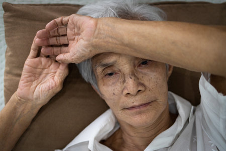 Tired,exhausted senior woman is suffering from insomnia, stress,unhealthy physical health and...