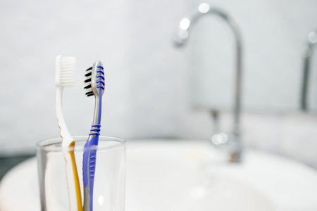 Toothbrushes are kept close together in the glasses,used toothbrushes should be separated to...