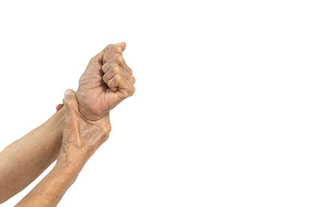 Hand of old elderly with a joint injury,painful in the wrist,disease of Carpal tunnel syndrome,Osteomyelitis,Arthritis,wrist bone pain,numbness in the hands or fingers,deficiency of calcium or vitaminの写真素材