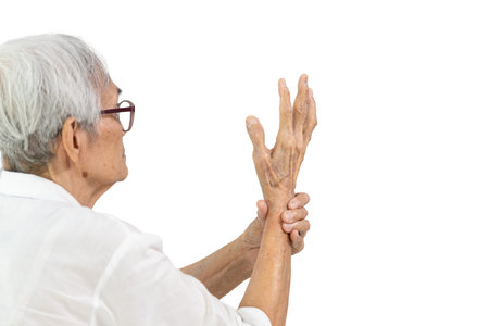 Asian senior people showing hands tremors,shaking of Parkinson's disease,old elderly with painful or...