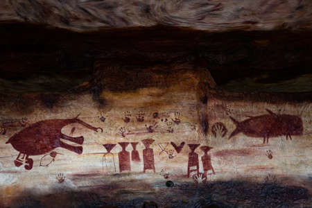 Ubon Ratchathani,Thailand-November 8,2021:The Prehistoric painting cliff,an ancient color paintings of rocky mountain cliff point at Pha Taem National Park,Khong Chiam District,travel on vacationのeditorial素材