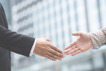 Men are holding hands to show the business vision