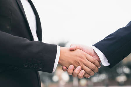 Image of businessman shaking handsの写真素材
