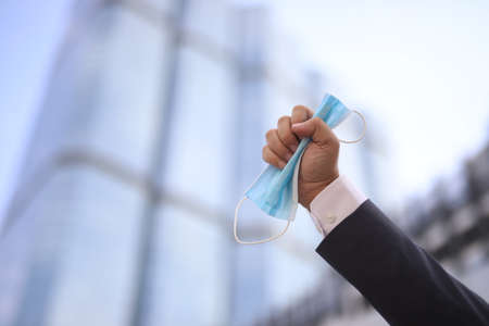 Businessmen traveling to work With a face mask to prevent covit-19の写真素材
