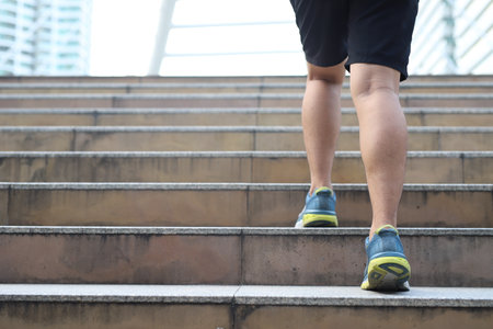 Men walk, run stairs, burn body fat, do cardio exercises, burn calories.の写真素材
