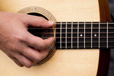 A man playing acoustic guitar To relaxの写真素材